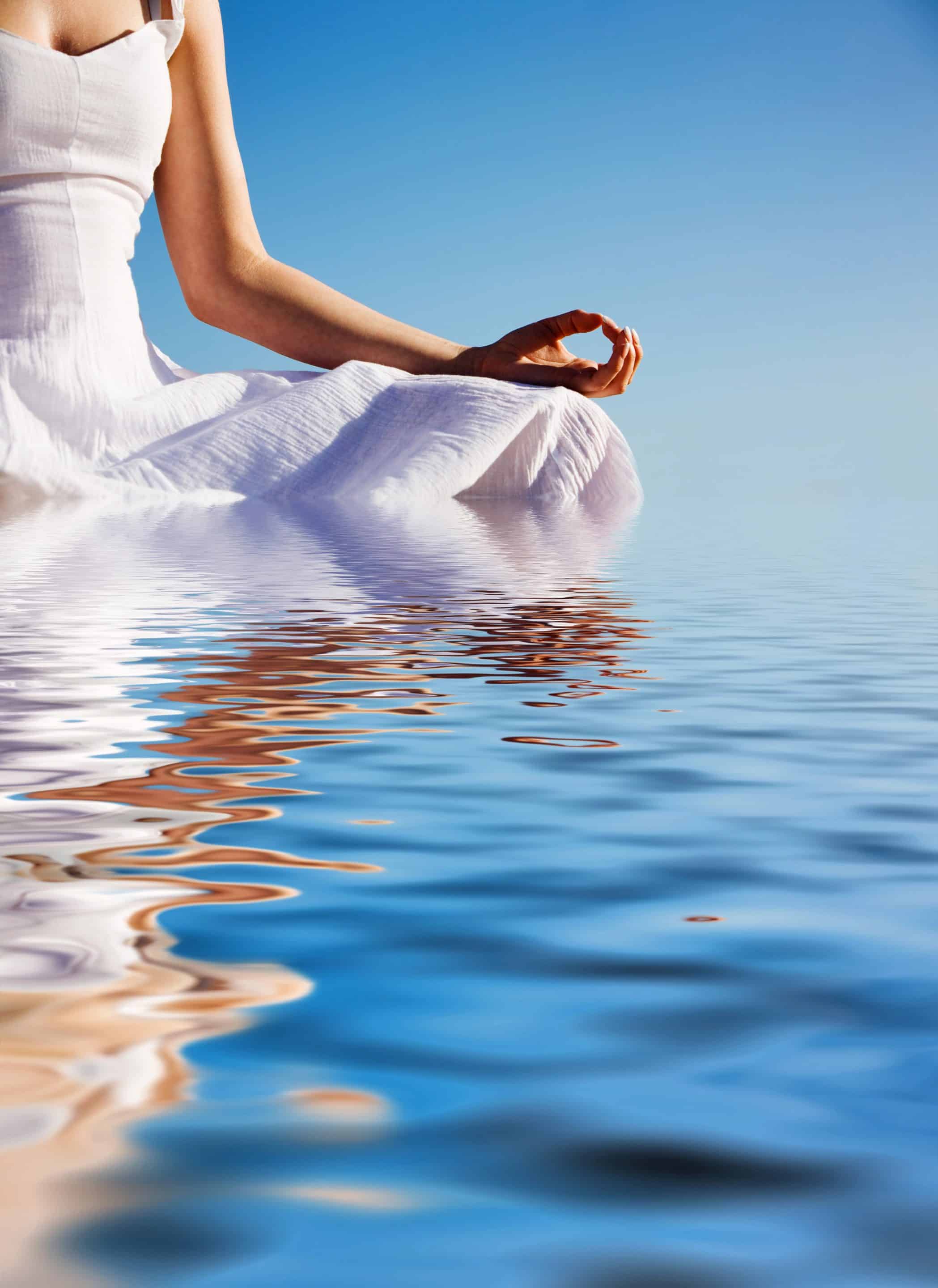 Depositphotos_6085559_XL Woman meditating by a calm lake, symbolising creative clarity and emotional healing for trauma-informed coaching